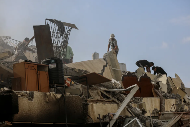 Israel levels Gaza district as relentless air raids continue